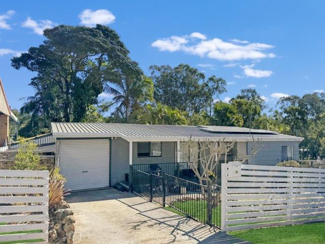 FULLY RENOVATED HIGH SET RESIDENCE WITH TROPICAL GARDENS