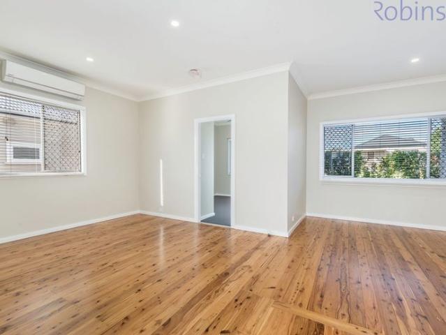 Fully renovated two bedroom plus sunroom home  the lawns are mowed for you!