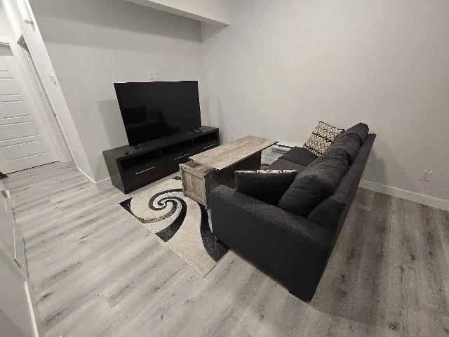 Furnished 1 Bed + Den Legal Basement Suite in Keswick – Utilities Included!