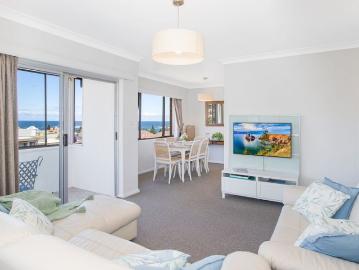 Furnished Top floor North East facing apartment framed by stunning ocean views