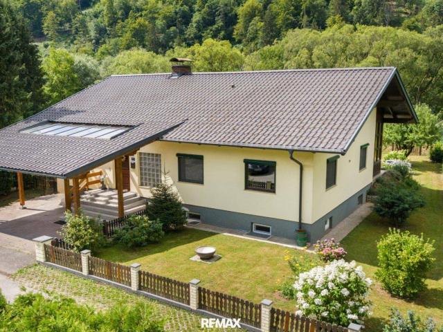 Gartenparadies in einzigartiger Naturlage: Gepflegter Bungalow mit Wintergarten direkt an der Drau in Lavamünd