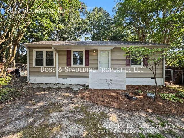 Garden Homes Charmer with Hardwood Floors and Fenced Yard