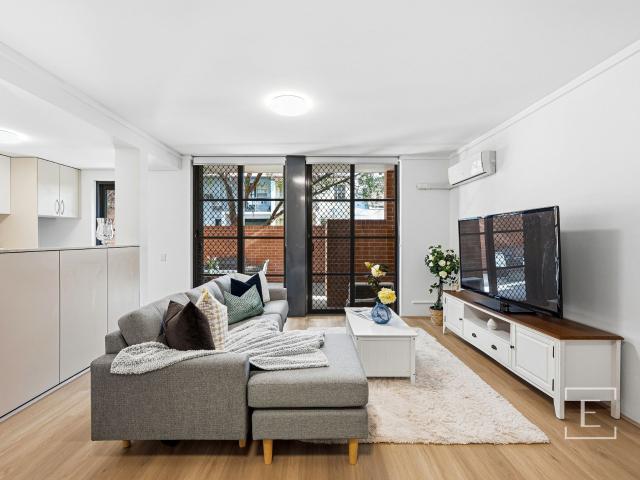 GARDEN OASIS FEATURING DUAL OUTDOOR ENTERTAINMENT SPACES
