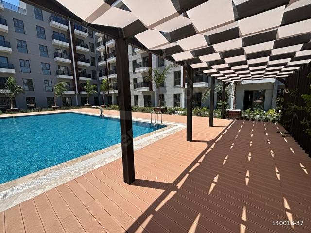 GAZİEMİR SİSTEM RESİDENC'DE 1+1 ZEMİN BAHÇELİ SATILIK DAİRE