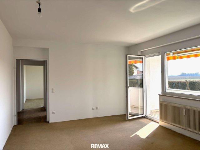 Gemütliche Erdgeschosswohnung mit Balkon, Parkplatz & Keller!