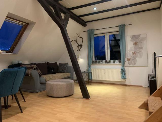 Gemütliche Wohnung im Obergeschoss mit eigener Dachterrasse