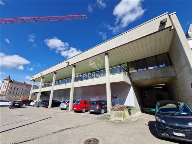 Gemischt genutzte Investitionsimmobilien und 19 Parkplätze in Delémont zum Verkauf