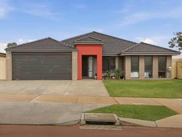 GENEROUS FAMILY HOME WITH EASY CARE GARDENS AND A SPARKLING BELOW GROUND POOL