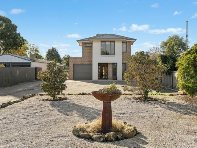 Generous Family Residence with Expansive Yard and Shedding