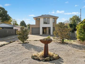 Generous Family Residence with Expansive Yard and Shedding
