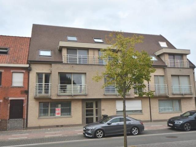 Gelijkvloers appartement met tuin en garage