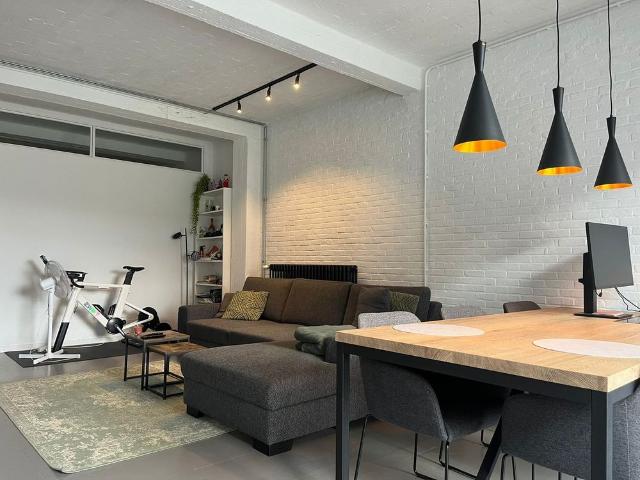 Gelijkvloers appartement met 1 slaapkamer, tuin en staanplaats nabij centrum Mol