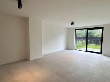 Gelijkvloers nieuwbouwappartement met tuin te huur in Lommel