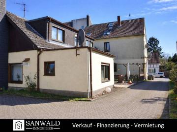 Gepflegtes Mehrfamilienhaus mit Anbau und Bauland inkl. positiver Bauvoranfrage