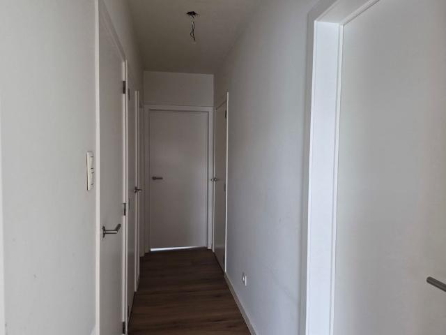 Gezellig gelijkvloers appartement met tuintje en parking