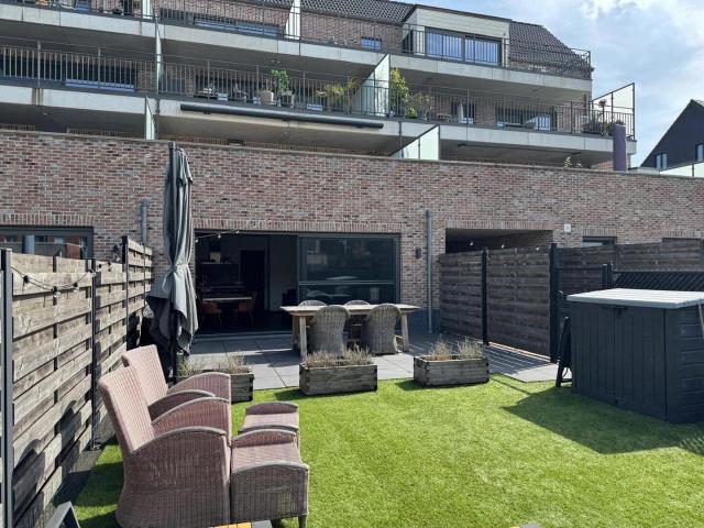 Gezellig gelijkvloers appartement met tuin en garagebox