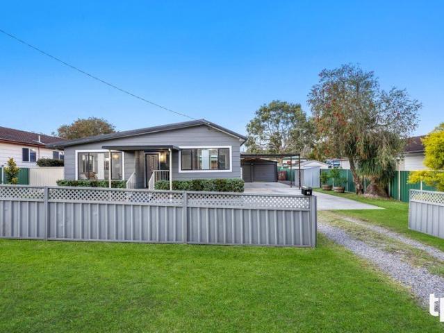 Good Looks and Great Garaging in Family Centric Community
