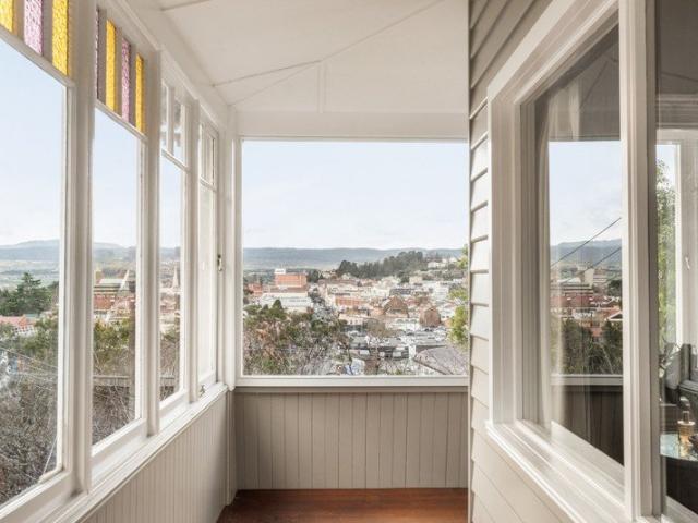 Gorgeous views over looking the Tamar Valley & CBD, wrap around sunroom and dual living floorplan with separate studio