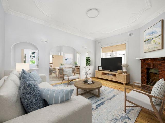 Ground Floor Art Deco Classic with Sunroom & Garden Access in a Premier Beachside Setting