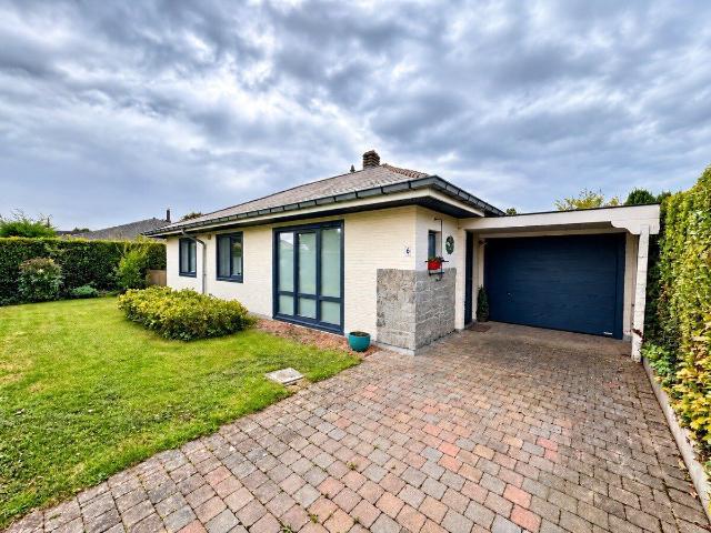 Ground floor property with garden and garage