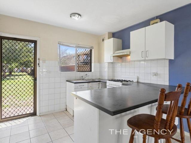 Renovate and Prosper! Ground Floor Unit with Enclosed Courtyard!