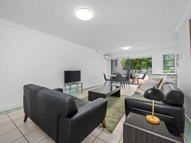 Ground Floor unit fully furnished with large wrap around patio 2 bed 2 bath 1 secured carspace 30 metres walk down to the Broadwater waterfront