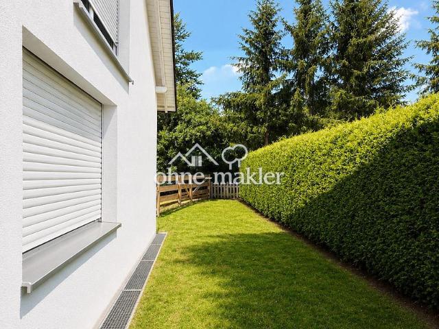 Großzügige 4 Zimmer Maisonette Wohnung mit Hauscharakter, Garten und 2 Garagen