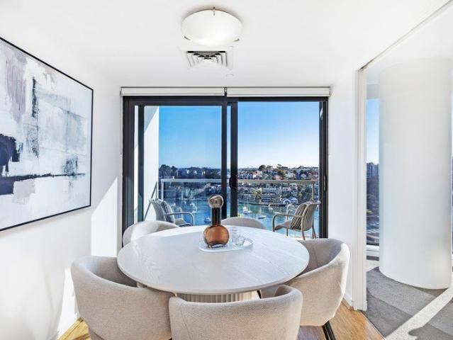 Gracefully poised above the sparkling waters of Lavender Bay