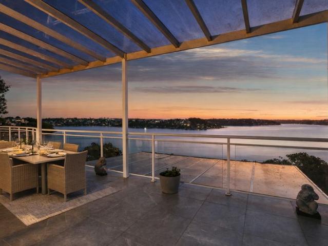 Grand Tri Level Waterfront Residence with Panoramic River Vistas