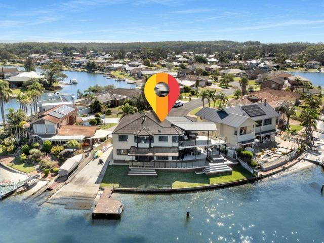 Grand Waterfront Living in Prestigious Dotterel Place