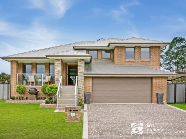 Grand Family Home with Pool, Theatre Room & Land!