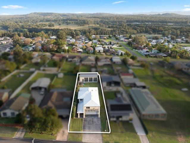 Grand family living with multiple living zones, side access and huge 12x8m shed