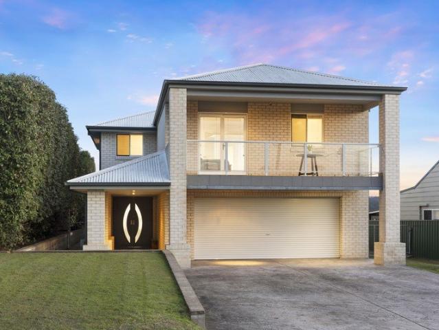 Grand family living with multiple living zones, side access and huge 12x8m shed