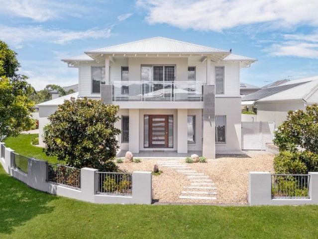 Grand Family Living with Poolside Luxury in Prestigious Club North