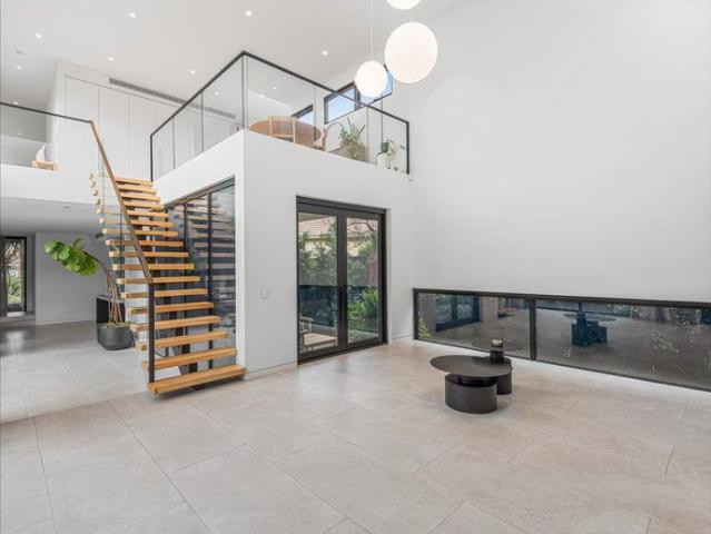 Grand Family Residence with Two Master Suites, Library & Double Living Area