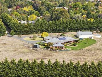 Grand Homestead Living on 6.2 Acres Character, Privacy and Proximity