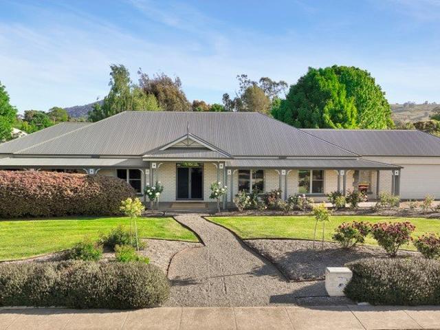 Grand Living in a Lush Garden Haven