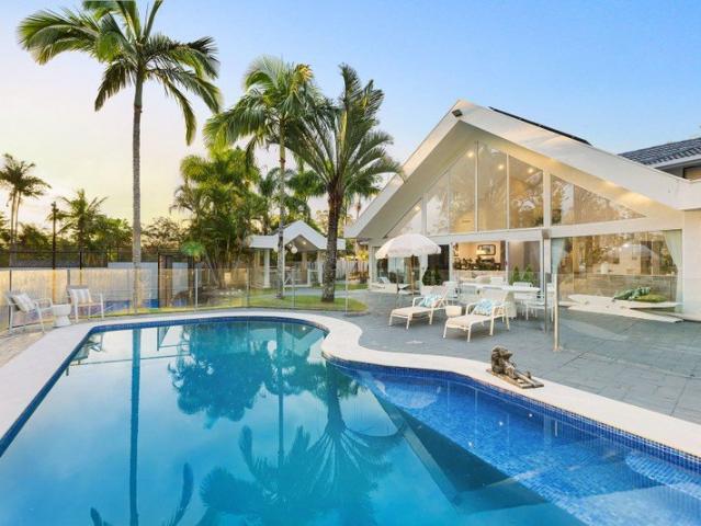 Grand Scale Acreage Estate with Resort Style Amenities and Rare Triple Living