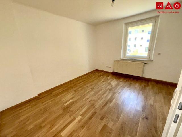 Günstige Starterwohnung in herrlicher Grünlage: praktische 1 Zimmerwohnung mit heller Wohnküche und separatem Schlafzimmer im kleinen Mehrparteienhaus – ideal für Singles, Studierende oder Pendler!