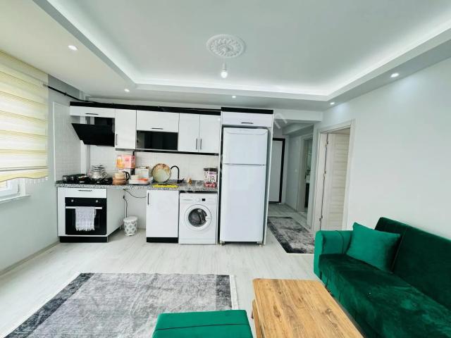 Güven'den Şehir Merkezin De Arakat Balkonlu Full Eşyalı 1+1daire