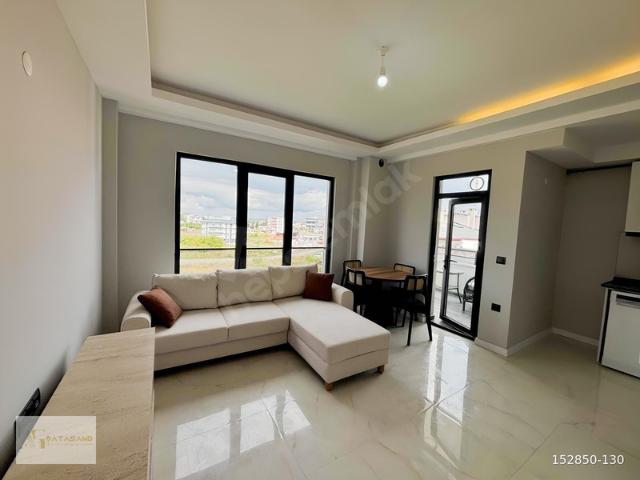 GÜZELYURT MAHALLESİNDE DENİZ MANZARALI 1+1 EŞYALI SATILIK DAİRE