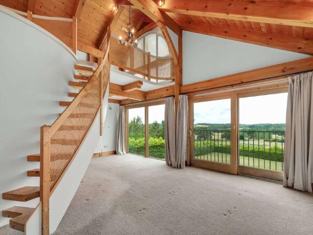 Hanger Lodge occupies an enviable setting, down a quiet country lane in Churt, close to Frensham Great Pond