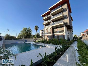 HAVALİMANINA YAKIN EŞYALI 1+1 HAVUZLU ALTINOVA'DA