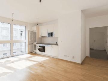 Helle 2 Zimmer Wohnung mit Markenküche Gemeinschaftsgarten | Garagenplatz inkludiert