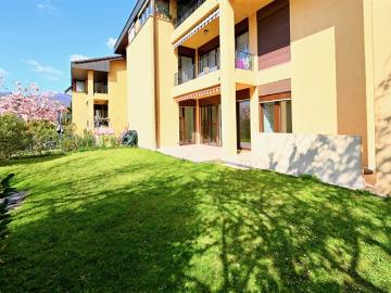 Helle Wohnung mit privatem Garten in Cureglia