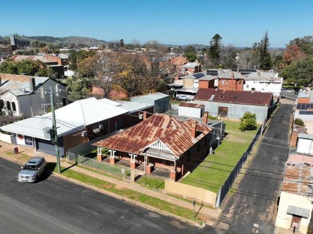 Hidden Gem with Historic Charm & Unmatched Potential