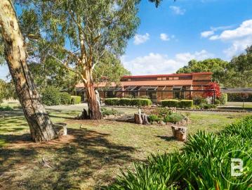HIGH QUALITY FOUR BEDROOM HOME WITH THREE LIVING AREAS ON 5 ACRES