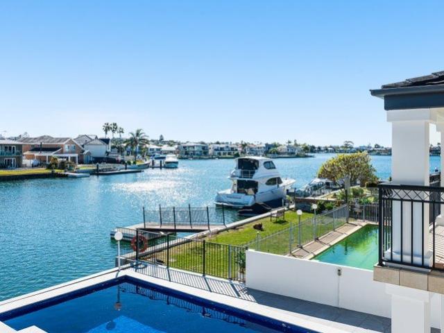Highly sought after Nth/West facing deep waterfront family entertainer