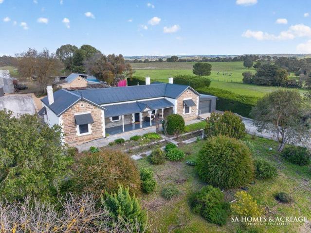 Historic Country Charm Across 60 Glorious Acres!