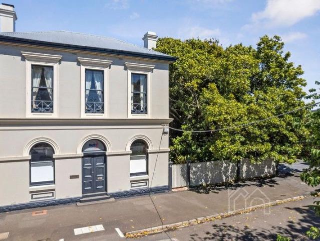 Historical bank, grand home, large studio, stunning landscaping, endless potential